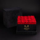 Black box with 25 red roses and SoulPetal branding on a black background
