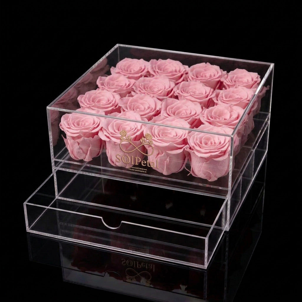 Clear acrylic box with 16 pink roses and SoulPetal branding on a black background