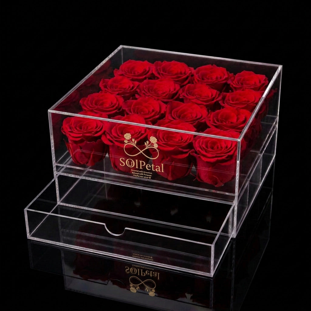 Clear acrylic box with 16 red roses and SoulPetal branding on a black background