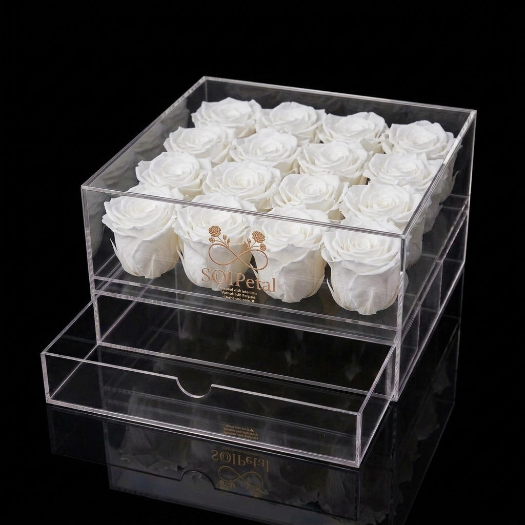 Clear acrylic box with 16 white preserved roses and SoulPetal  branding on a black background