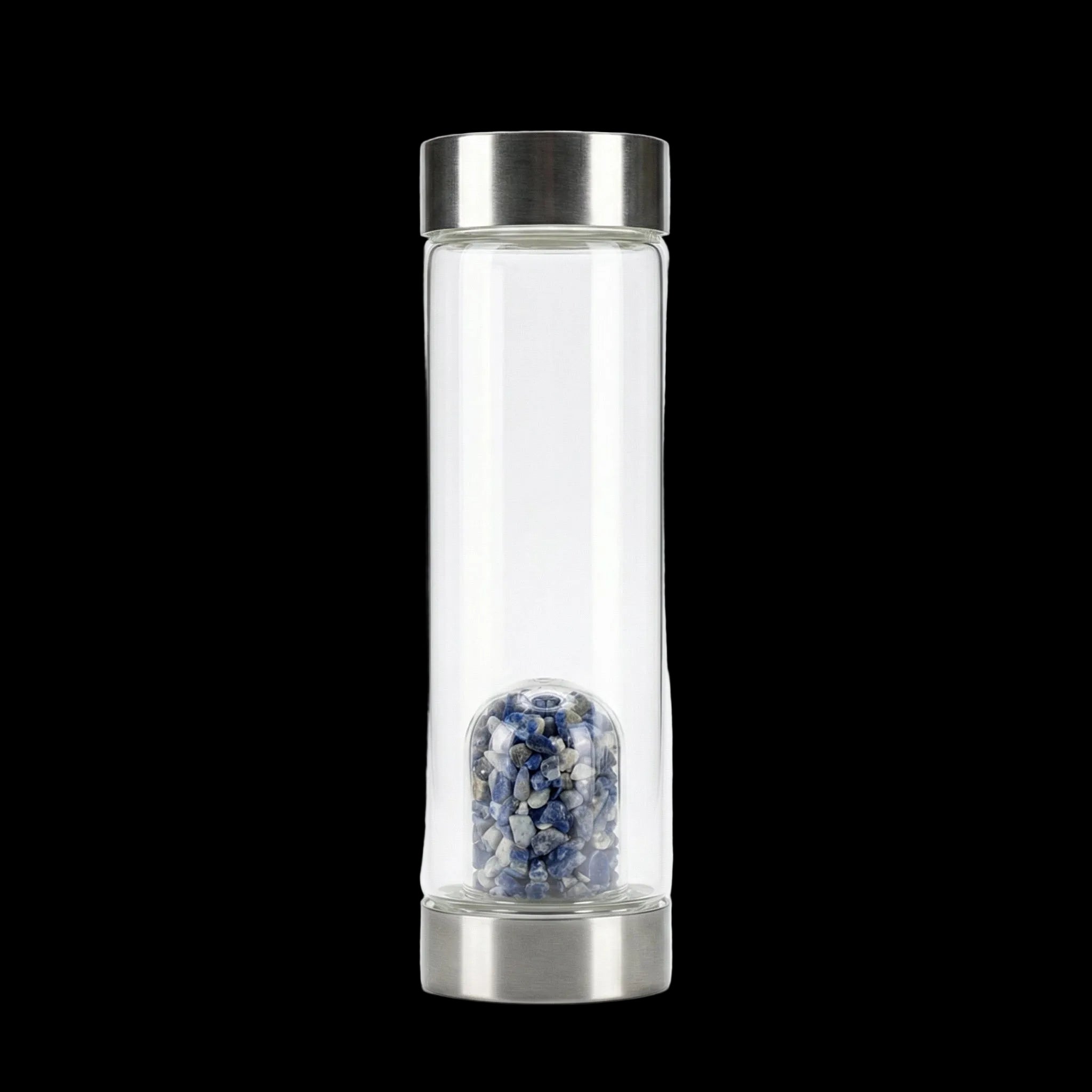 Clear glass bottle with metal cap containing small stones on a white background