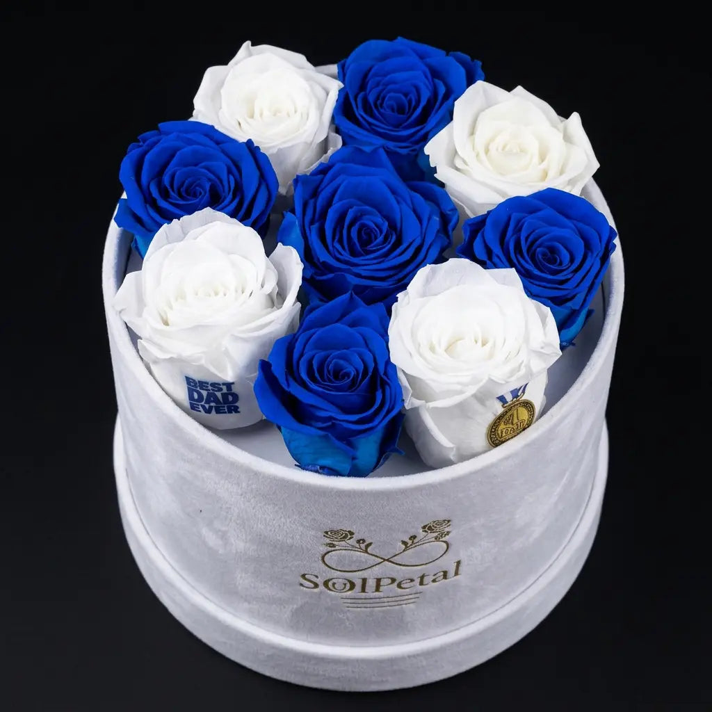 White and blue roses in a white round box with SoulPetal branding.